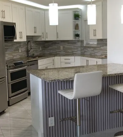 a kitchen with granite countertop a sink and a stove