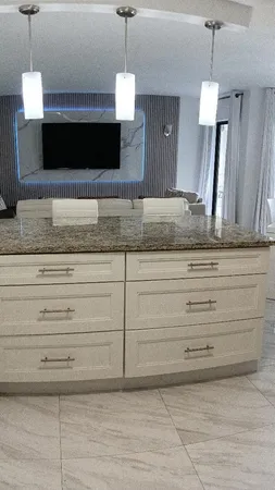 a kitchen with a sink and cabinets