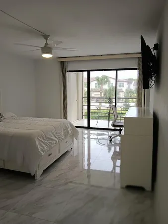 a bedroom with a bed and a night stand