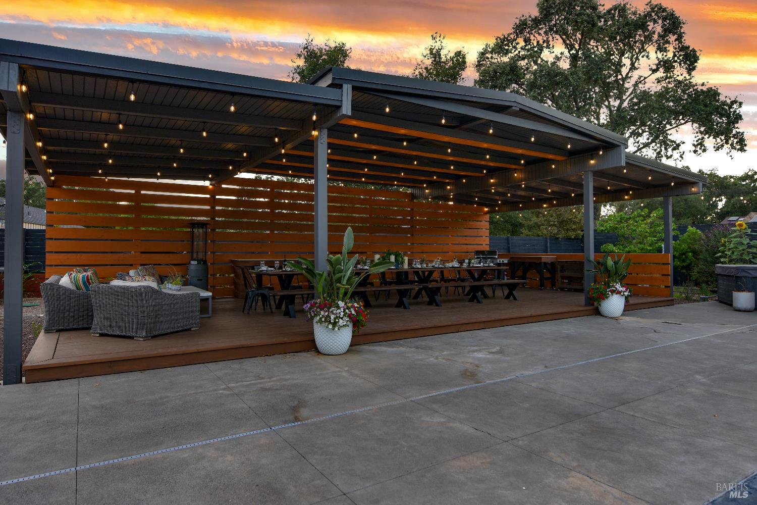 85 Trinity Road Glen Ellen, CA 95442 - Photo 55 of 62 a view of the patio with dining table and chairs under an umbrella