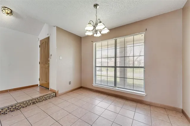 a view of kitchen with windows and ceiling fan