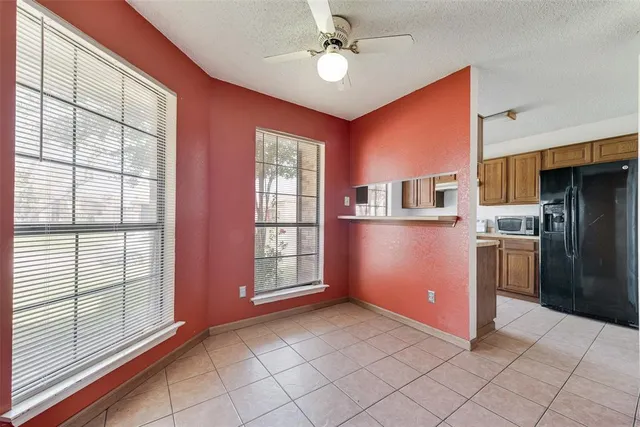 a kitchen with a sink stove top oven and cabinets
