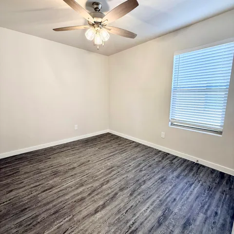 a view of an house with backyard and outdoor kitchen