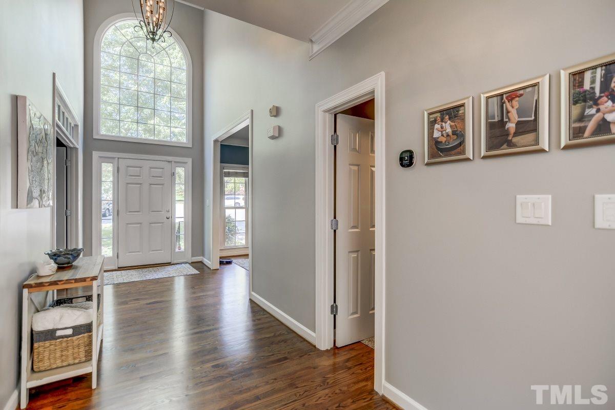 8401 Wapello Lane Raleigh, NC 27613 - Photo 3 of 26 a view of an entryway with wooden floor and a window