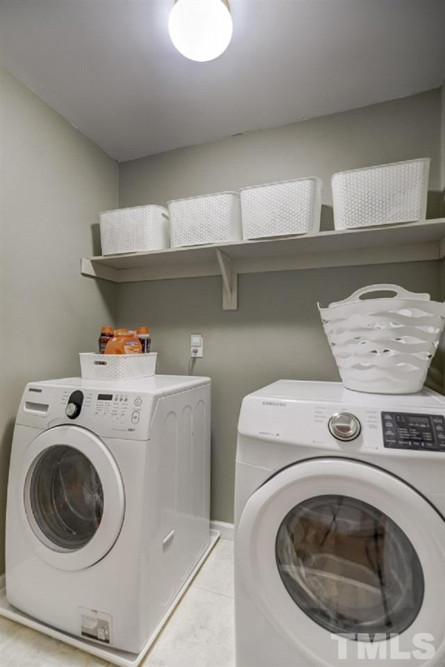 8401 Wapello Lane Raleigh, NC 27613 - Photo 22 of 26 a utility room with dryer and washer