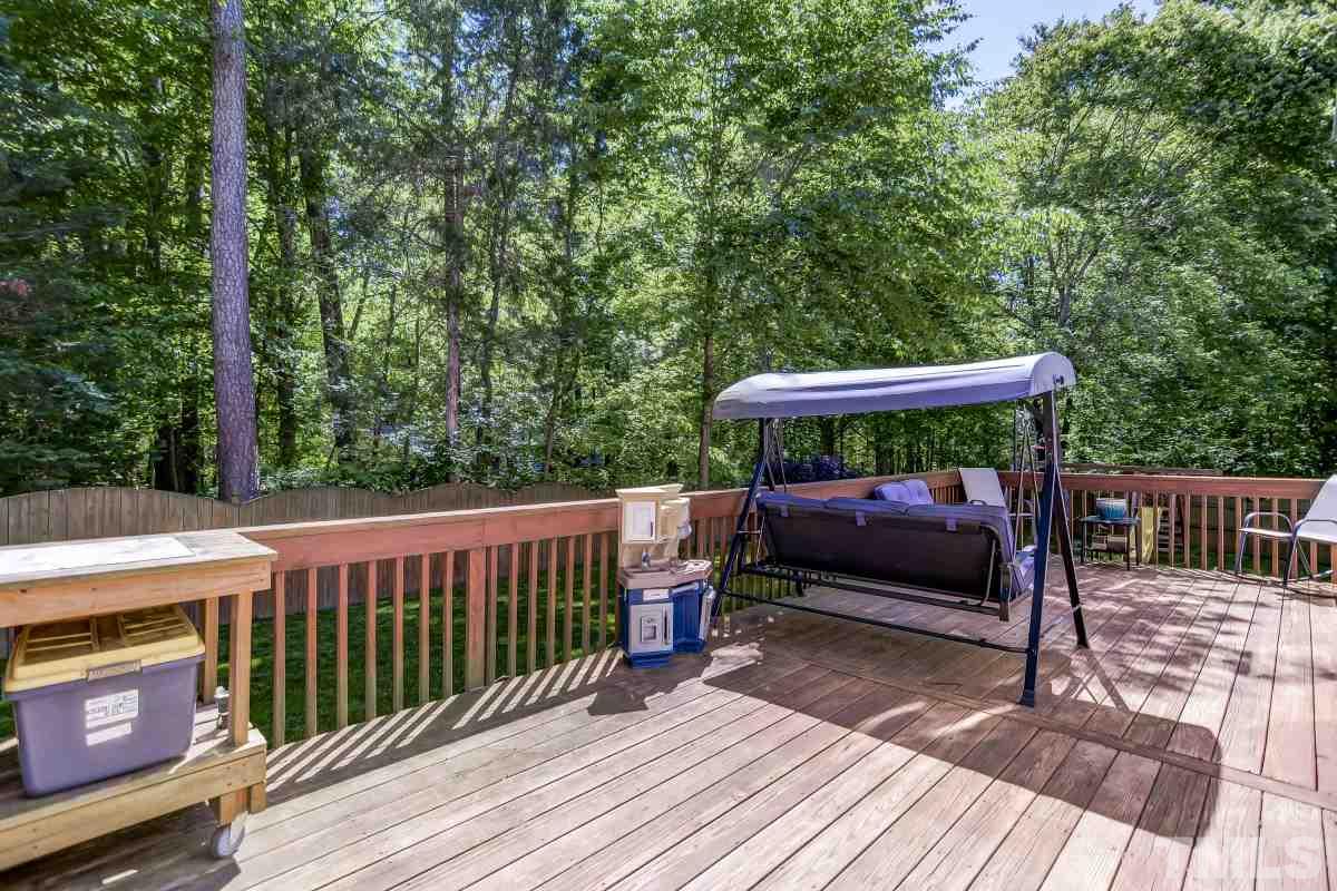 8401 Wapello Lane Raleigh, NC 27613 - Photo 23 of 26 a view of backyard with a deck and wooden floor