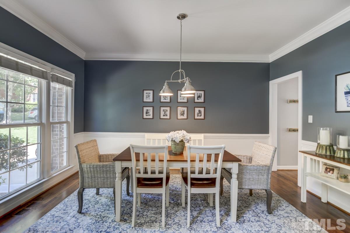 8401 Wapello Lane Raleigh, NC 27613 - Photo 5 of 26 a view of a dining room with furniture window and outside view