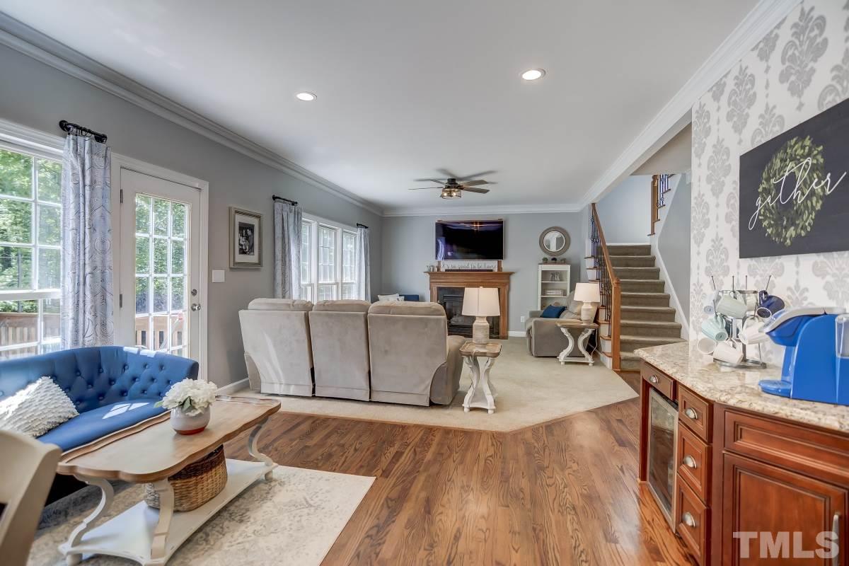 8401 Wapello Lane Raleigh, NC 27613 - Photo 8 of 26 a living room with furniture and a wooden floor