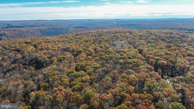 a view of a large body of water with a building in the background