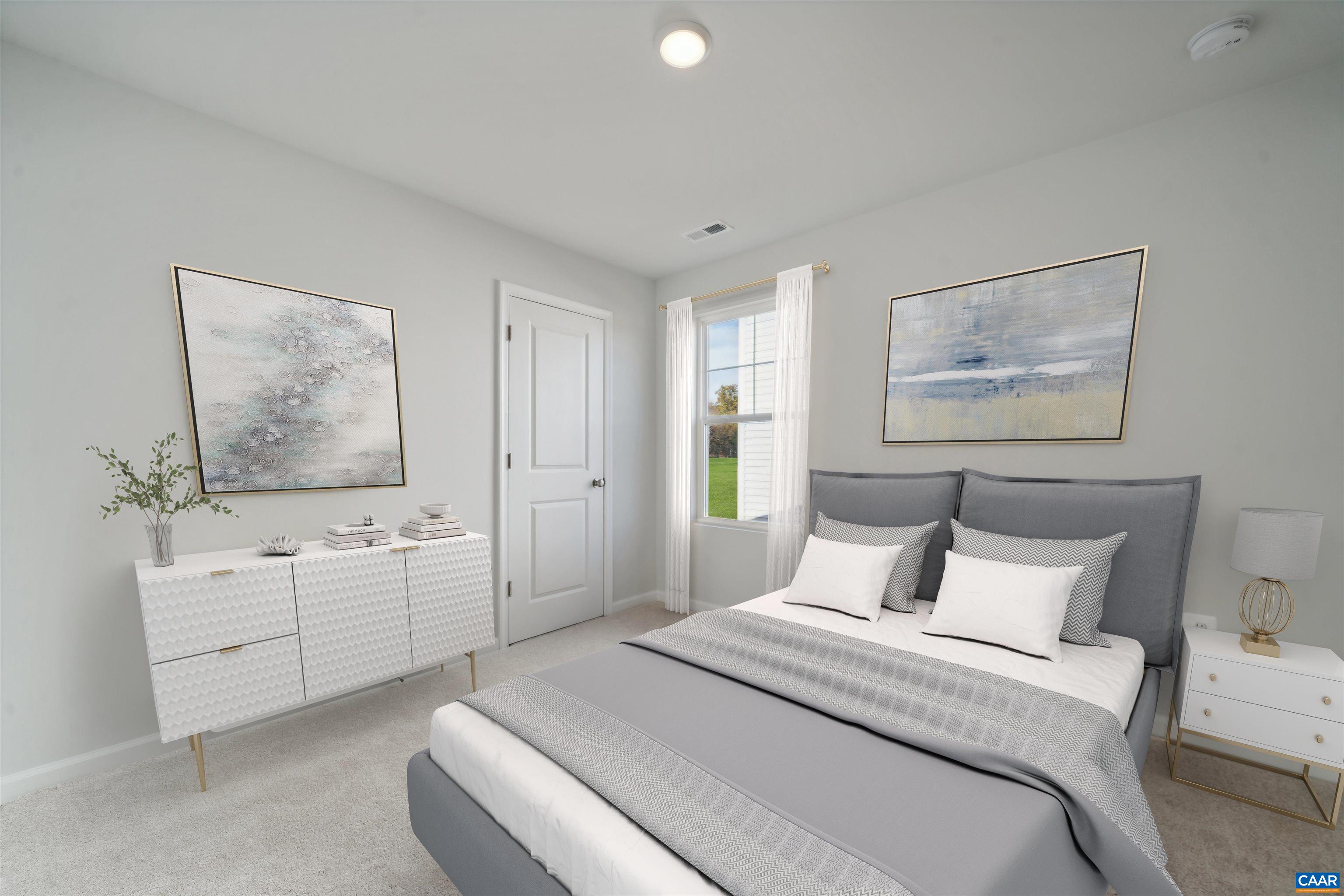 259 Trailfork Road Barboursville, VA 22923 - Photo 12 of 40 a spacious bedroom with a bed and a chandelier