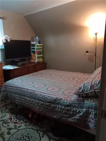 a living room with furniture rug and a window