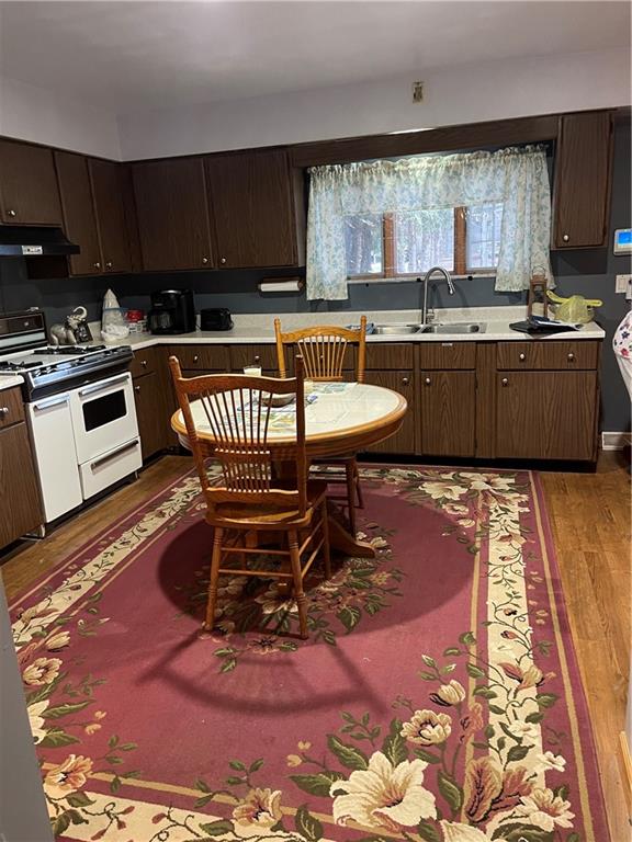 528 Longfellow Street Vandergrift, PA 15690 - Photo 14 of 23 a kitchen with stainless steel appliances granite countertop a sink a stove a counter space and cabinets