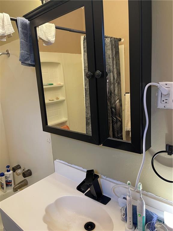 528 Longfellow Street Vandergrift, PA 15690 - Photo 22 of 23 a bathroom with a sink and a mirror