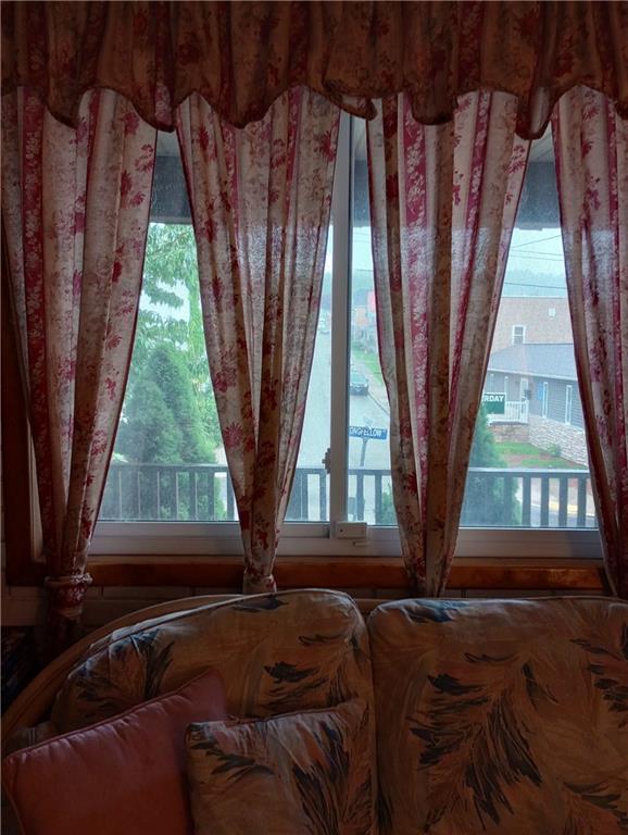 528 Longfellow Street Vandergrift, PA 15690 - Photo 10 of 23 a bed sitting in a bedroom next to a window