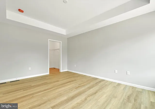 a bathroom with a toilet a sink and a mirror