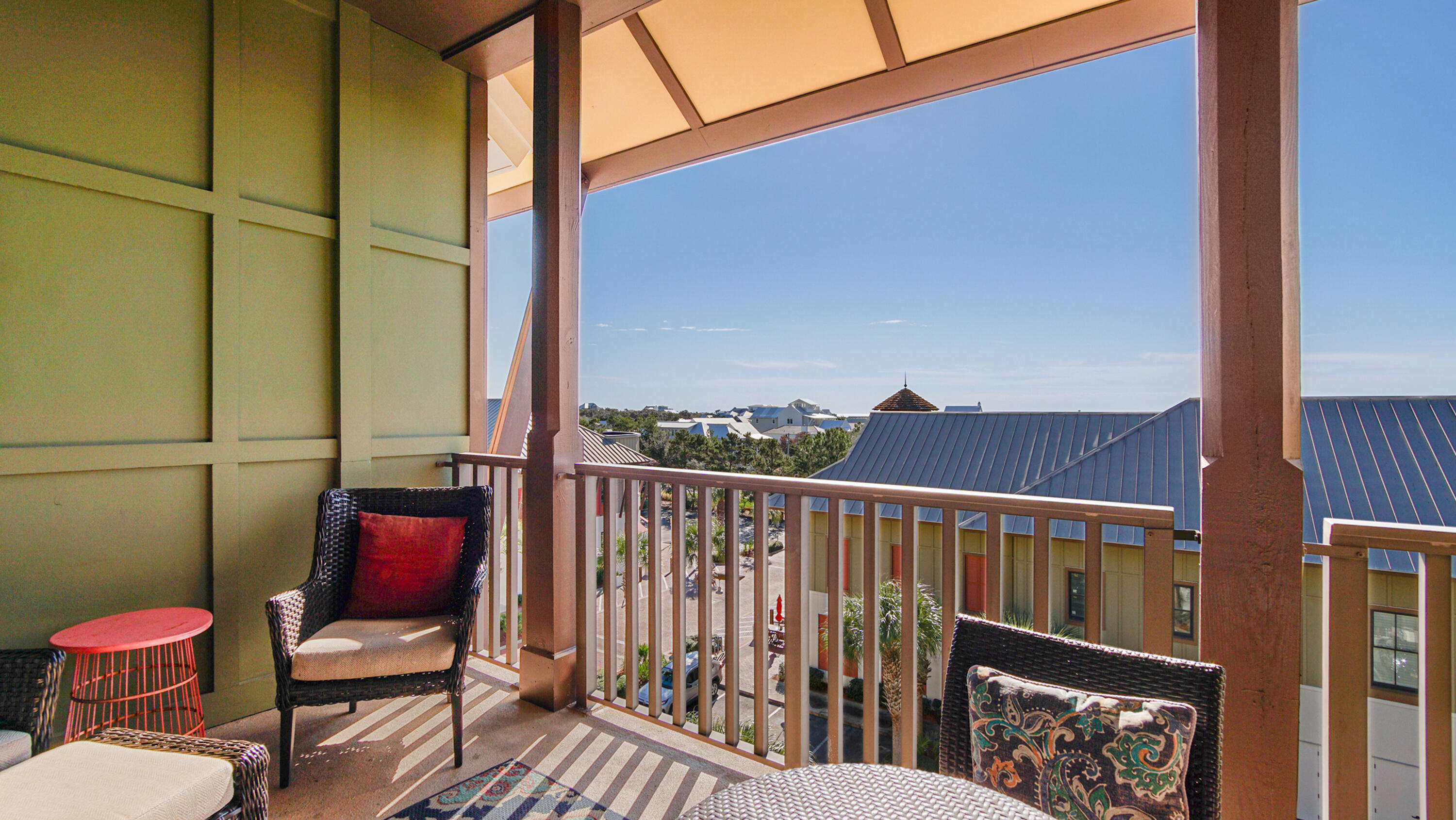 2050 West County Highway 30A, Unit M1408 Santa Rosa Beach, FL 32459 - Photo 11 of 25 a view of a balcony with chair and wooden floor