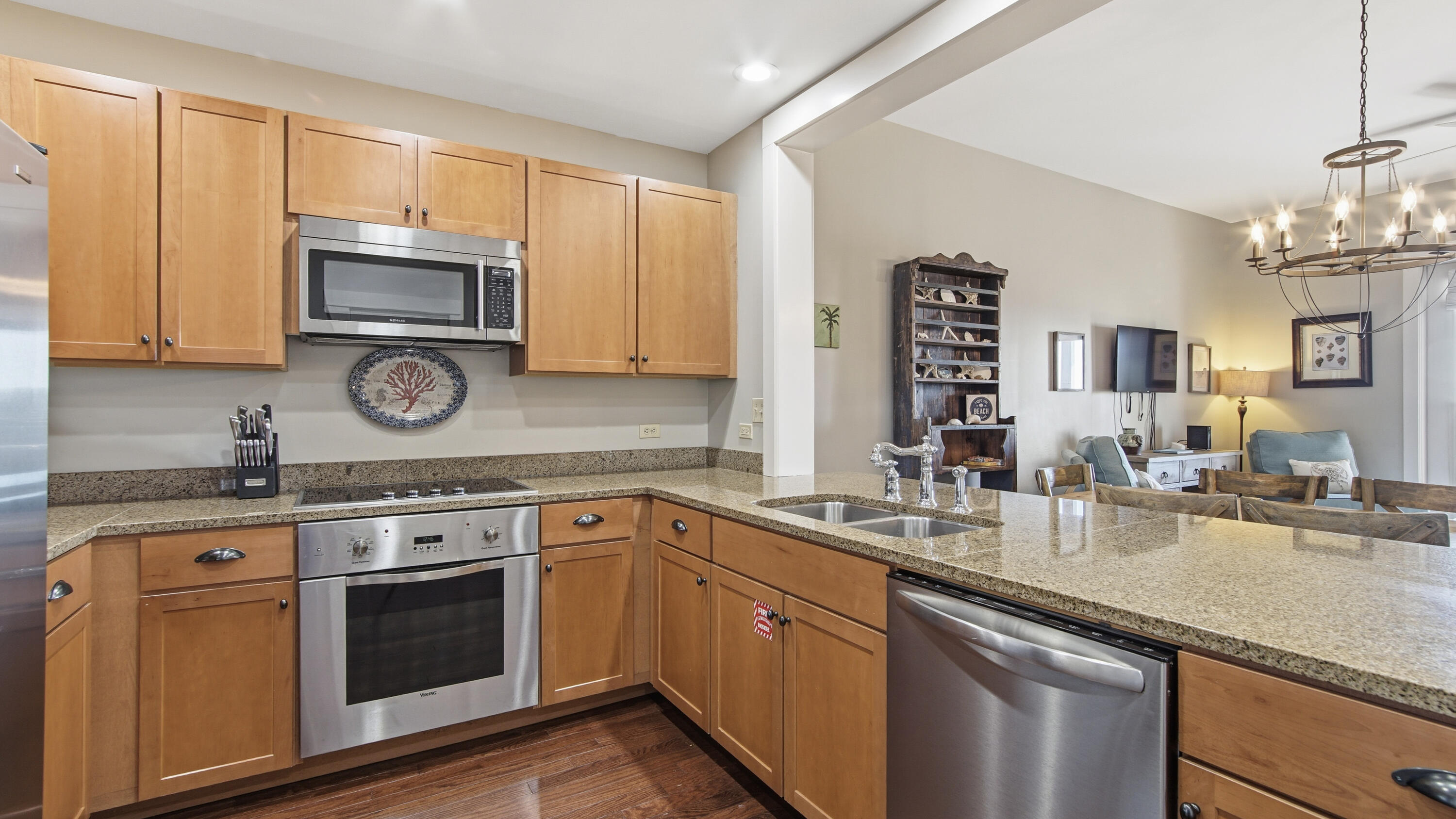 2050 West County Highway 30A, Unit M1408 Santa Rosa Beach, FL 32459 - Photo 12 of 25 a kitchen with stainless steel appliances granite countertop a sink stove and microwave