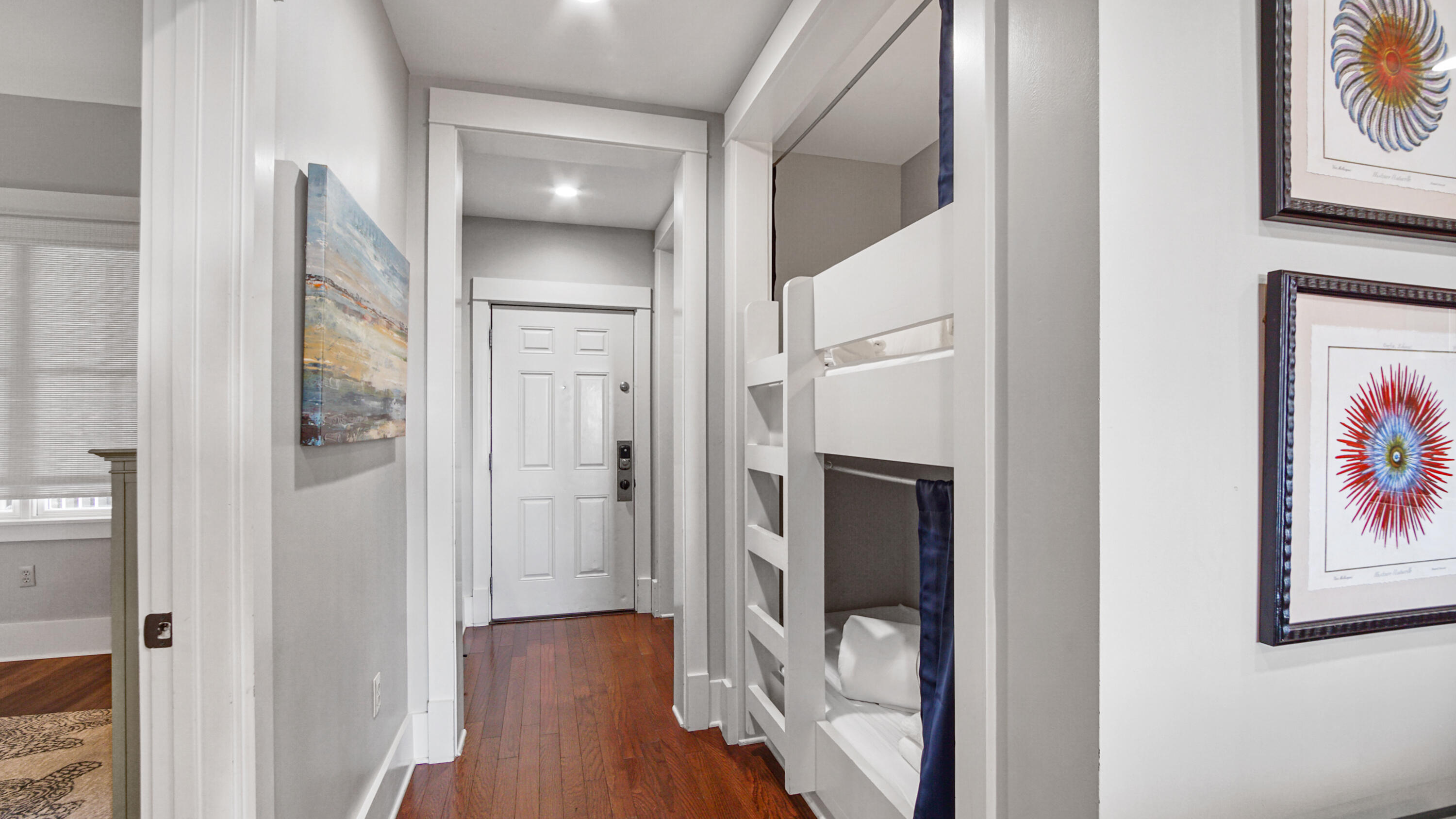2050 West County Highway 30A, Unit M1408 Santa Rosa Beach, FL 32459 - Photo 21 of 25 a view of a hallway with wooden floor and staircase