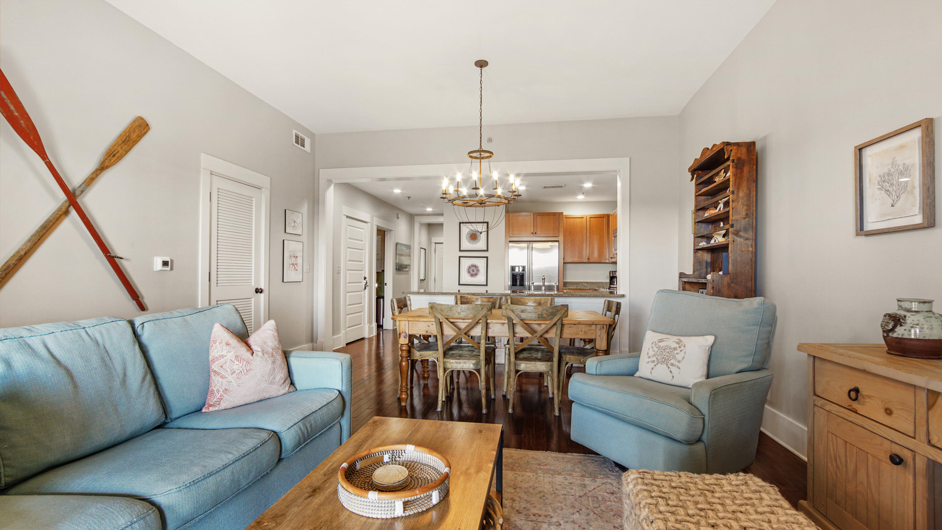 2050 West County Highway 30A, Unit M1408 Santa Rosa Beach, FL 32459 - Photo 10 of 25 a living room with furniture and a chandelier