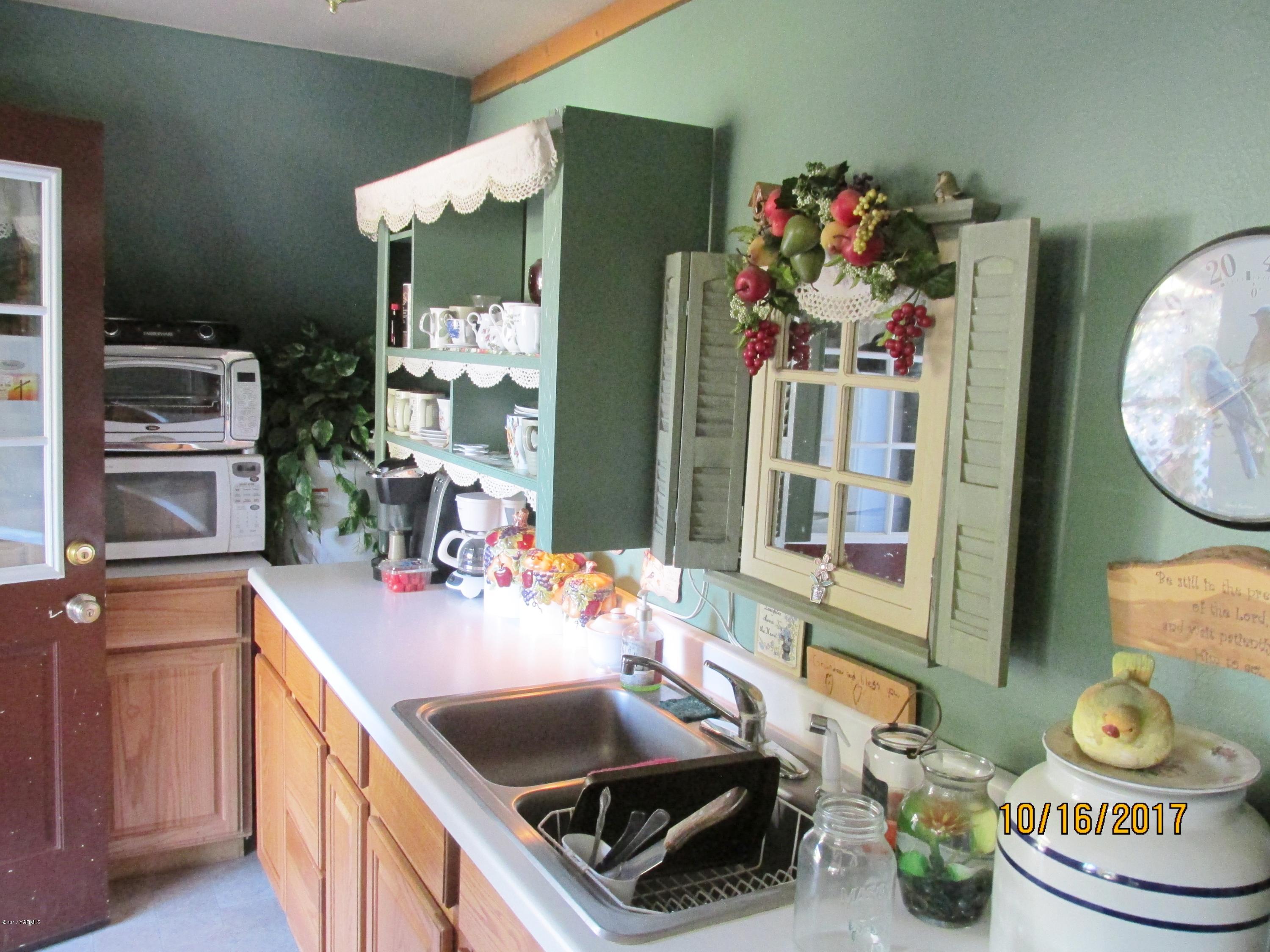 1172 North Cowiche Road Tieton, WA 98947 - Photo 43 of 46 a kitchen with a sink and stove top oven