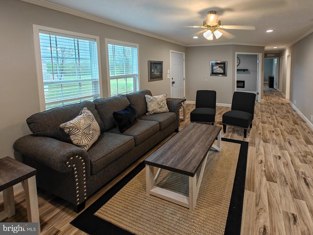 12623 Shell Mill Road, Unit 67 Bishopville, MD 21813 - Photo 3 of 22 a living room with furniture and a large window