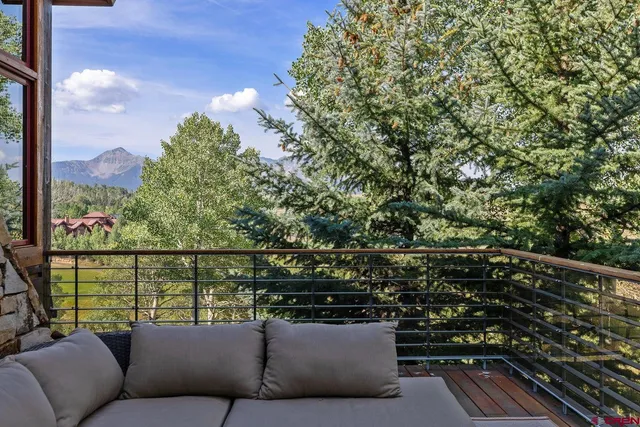 a view of a balcony with furniture