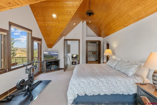 a bed room with a bed and a fireplace