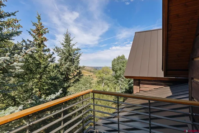 a view of balcony with furniture