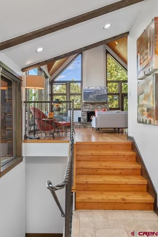 a room with pool table and windows