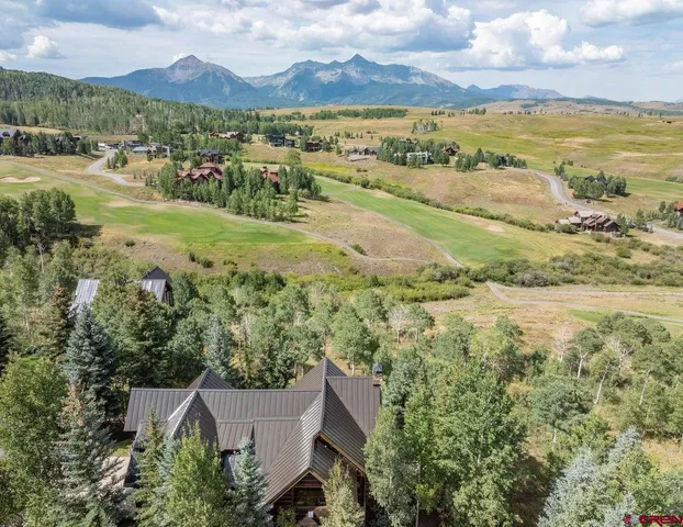 a view of an ocean and a mountain