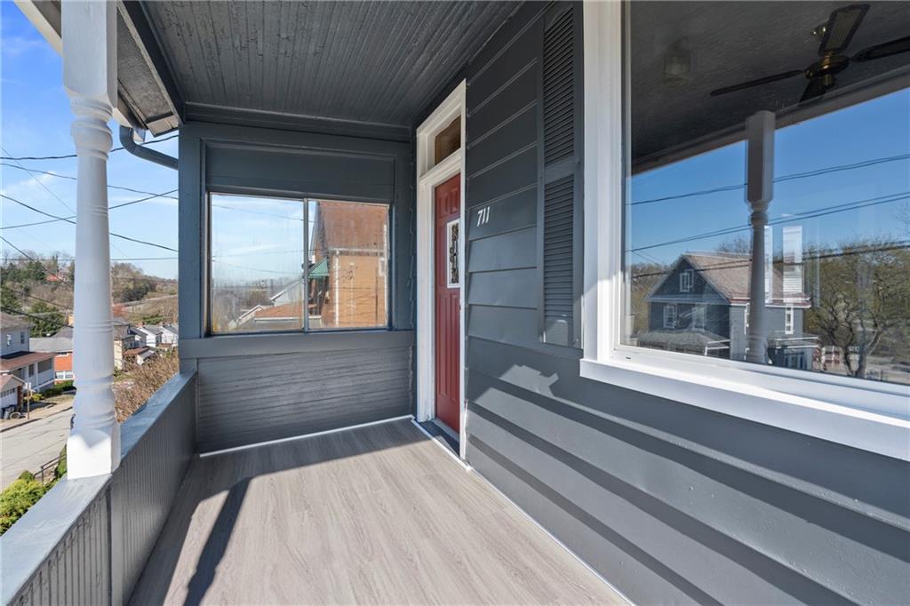 711 9th Avenue Irwin, PA 15642 - Photo 4 of 26 a room with a large window and a rug