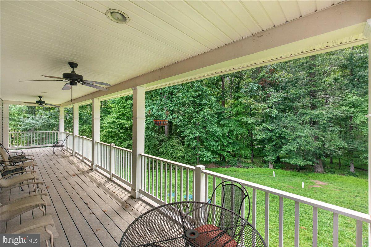 2516 Daisy Road Woodbine, MD 21797 - Photo 70 of 78 Serene porch overlooking lush greenery.