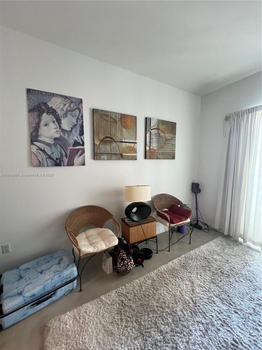 234 Northeast 3rd Street, Unit 1908 Miami, FL 33132 - Photo 5 of 15 a living room with furniture and a window
