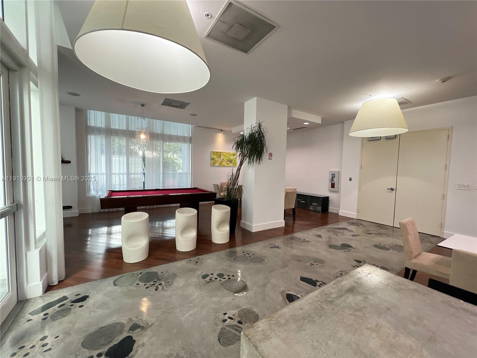 234 Northeast 3rd Street, Unit 1908 Miami, FL 33132 - Photo 10 of 15 a living room with furniture and a fireplace