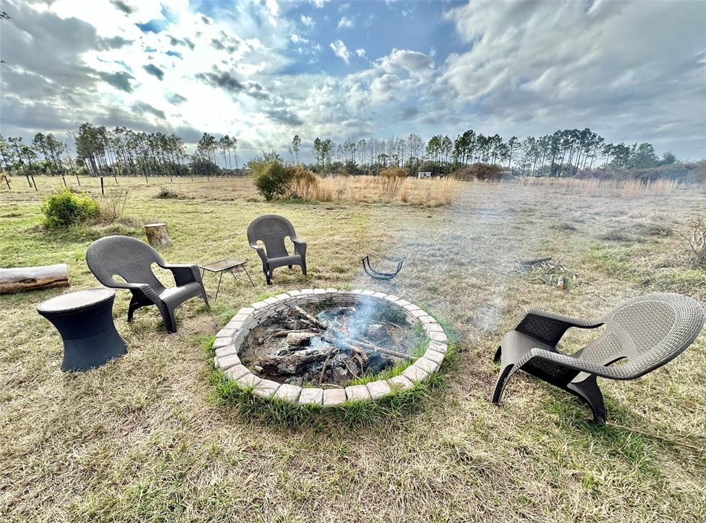 14780 Sugarbowl Road Myakka City, FL 34251 - Photo 15 of 53 a view of a lake with outdoor seating