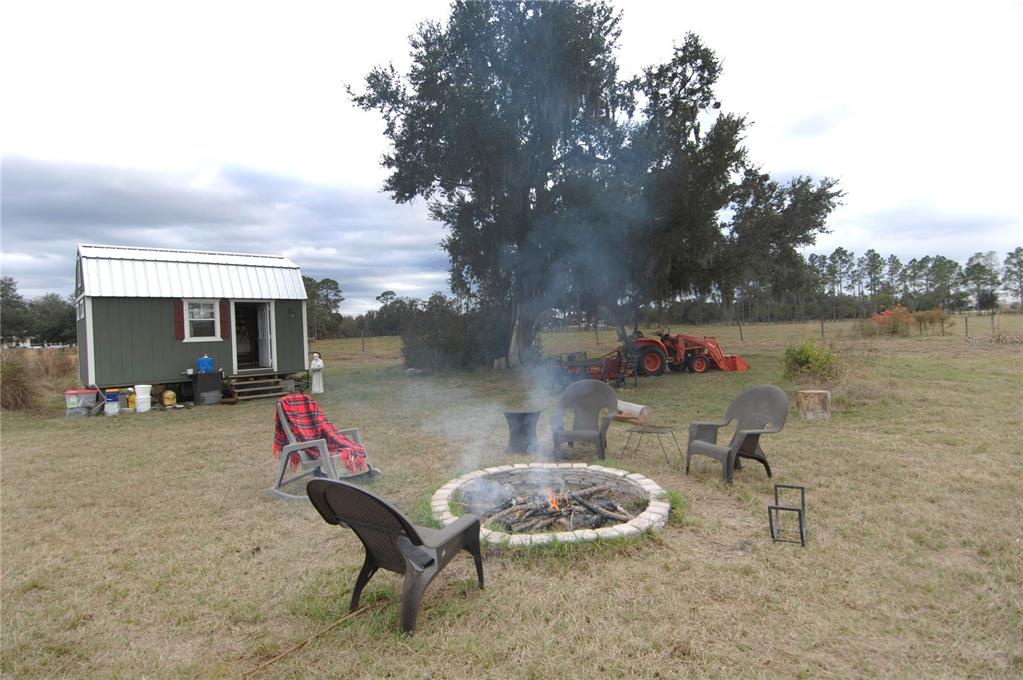 14780 Sugarbowl Road Myakka City, FL 34251 - Photo 20 of 53 a view of a patio with table and chairs and potted plants