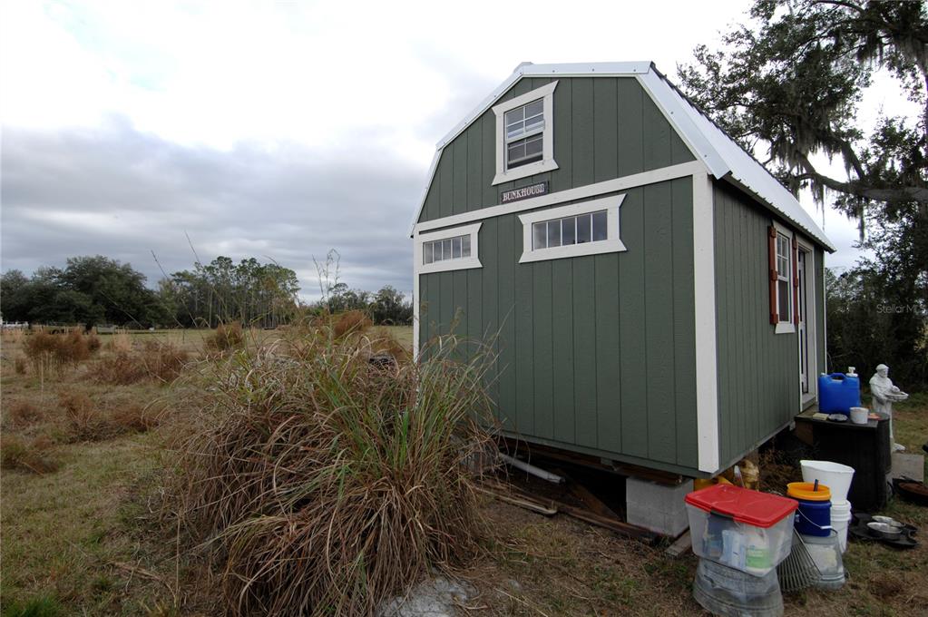 14780 Sugarbowl Road Myakka City, FL 34251 - Photo 24 of 53 a front view of a house with yard and seating area