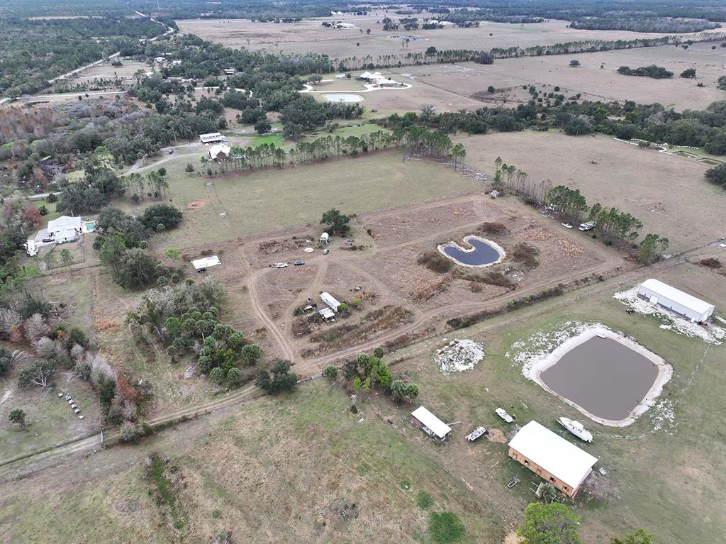14780 Sugarbowl Road Myakka City, FL 34251 - Photo 27 of 53 an aerial view of a house with a lake view