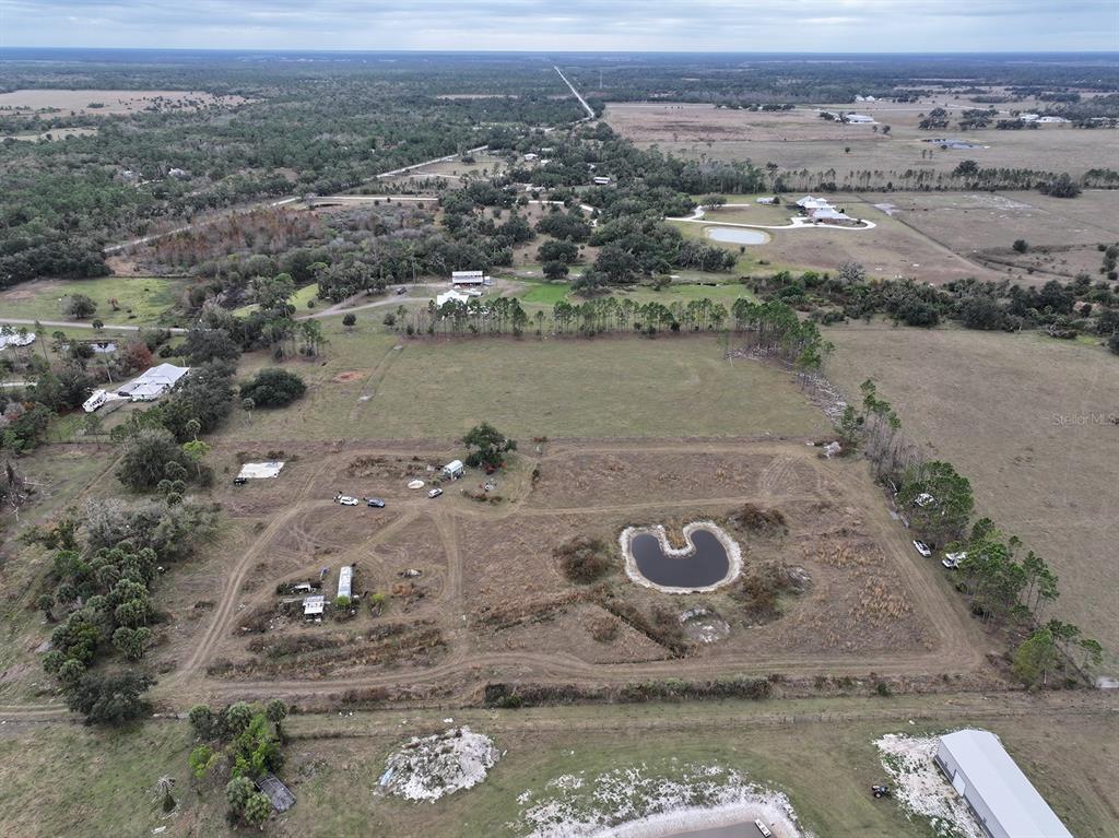 14780 Sugarbowl Road Myakka City, FL 34251 - Photo 29 of 53 an aerial view of a house with a lake view