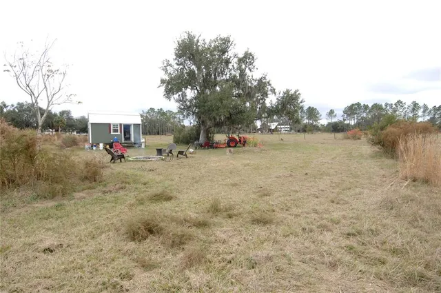 a view of a lake view with houses in back