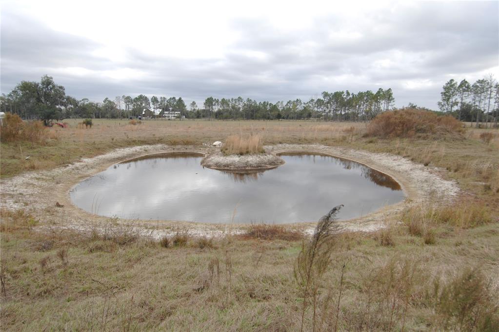 14780 Sugarbowl Road Myakka City, FL 34251 - Photo 42 of 53 a view of a lake with outdoor space