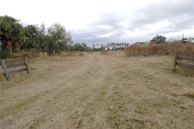 a view of a lake with a yard