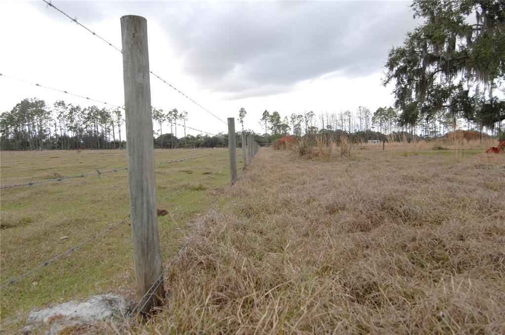 14780 Sugarbowl Road Myakka City, FL 34251 - Photo 48 of 53 a view of a lake with a yard