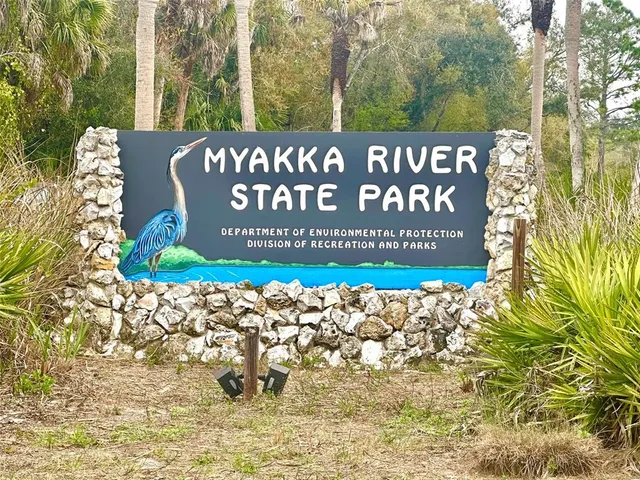 a room with lots of white furniture and window