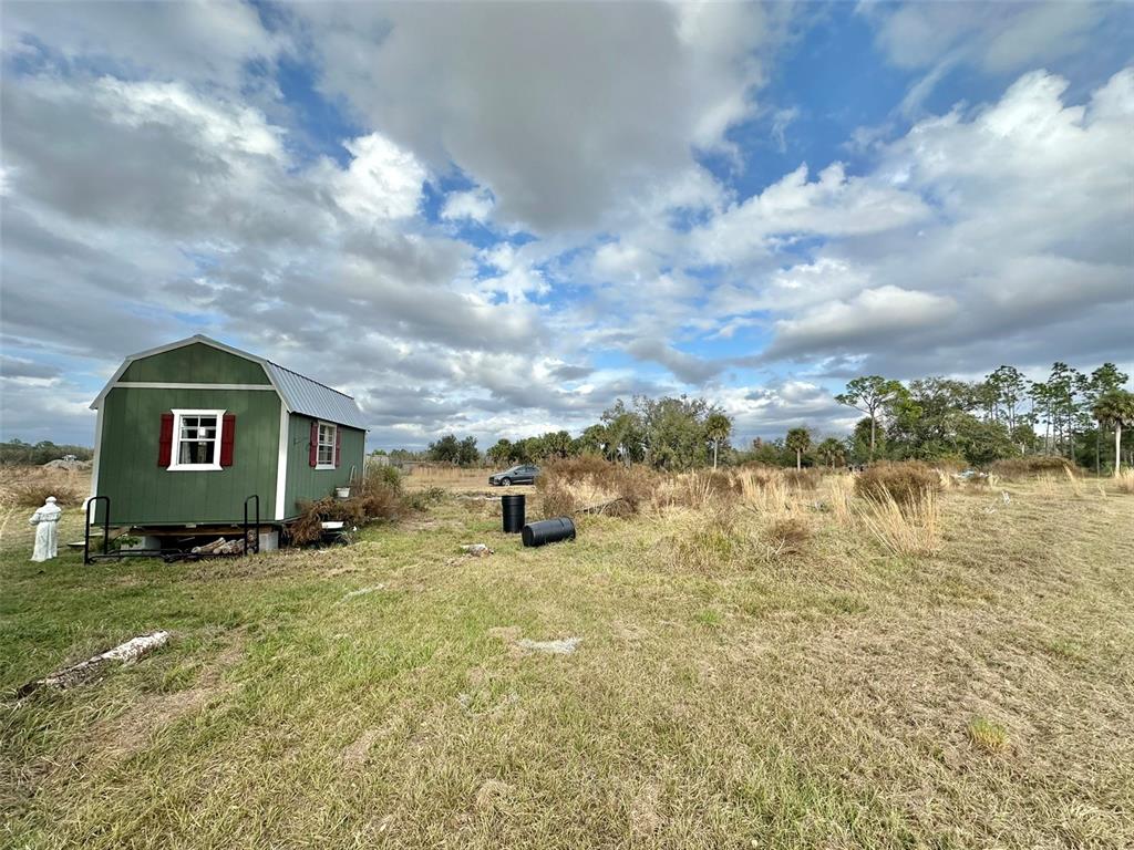 14780 Sugarbowl Road Myakka City, FL 34251 - Photo 7 of 53 a view of a lake with houses in the back