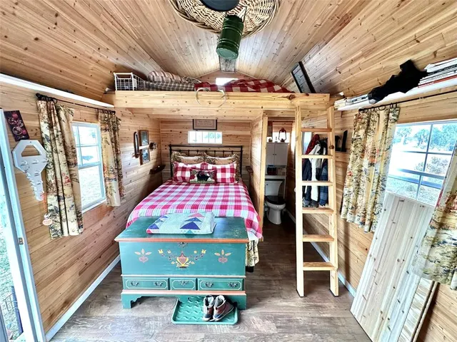 a bedroom with a bed and a table