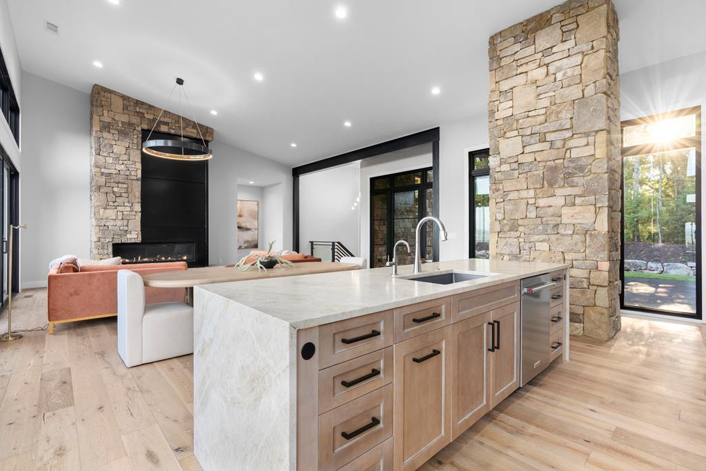 417 Bill Claypool Drive Blue Ridge, GA 30513 - Photo 17 of 73 a large kitchen with kitchen island a sink a counter top space and living room view