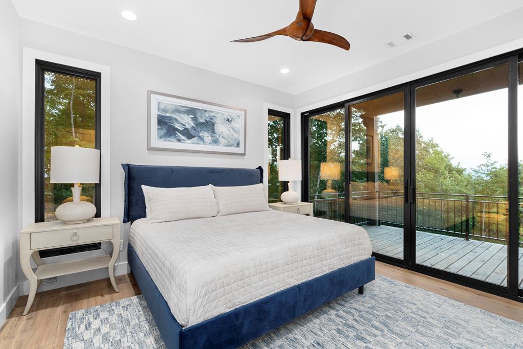 417 Bill Claypool Drive Blue Ridge, GA 30513 - Photo 43 of 73 a bedroom with a large bed and a large window