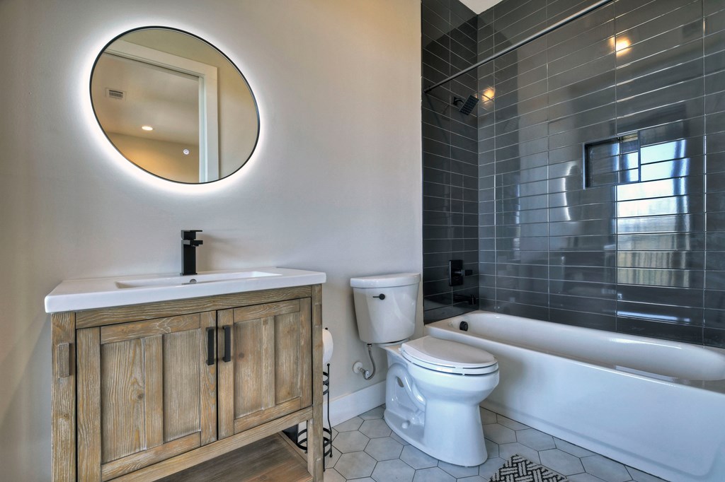 417 Bill Claypool Drive Blue Ridge, GA 30513 - Photo 50 of 73 a bathroom with a toilet a sink and a mirror