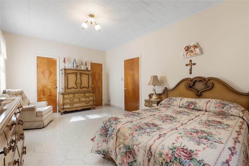 159 Hastings Street Brooklyn, NY 11235 - Photo 11 of 32 a bedroom with a bed and ceiling fan